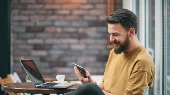 man-on-phone-in-coffee-shop