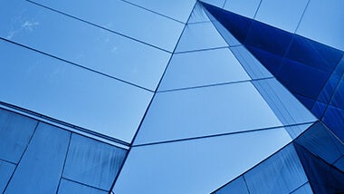 blue glass building with horizontal lines