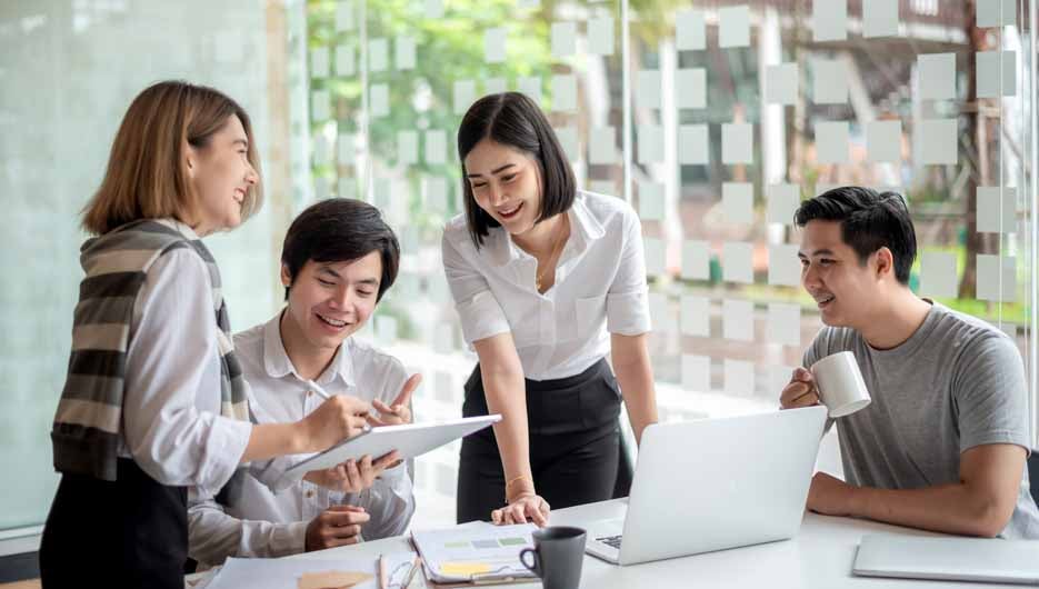 Young asian business group with the creative work, talk and exch